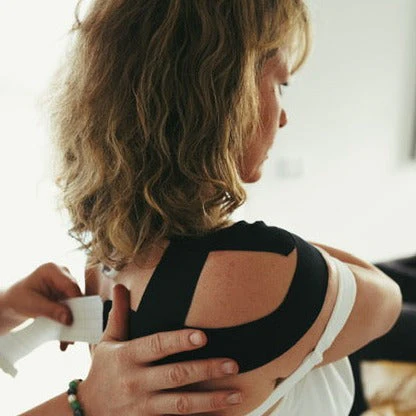 Kinesio Taping (Injury Rehab/ Posture Correction) being applied